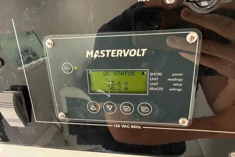 Slide: The Image of Mastervolt control panel displaying DC status on Fountain 38 SCX, 2023 model. - 21