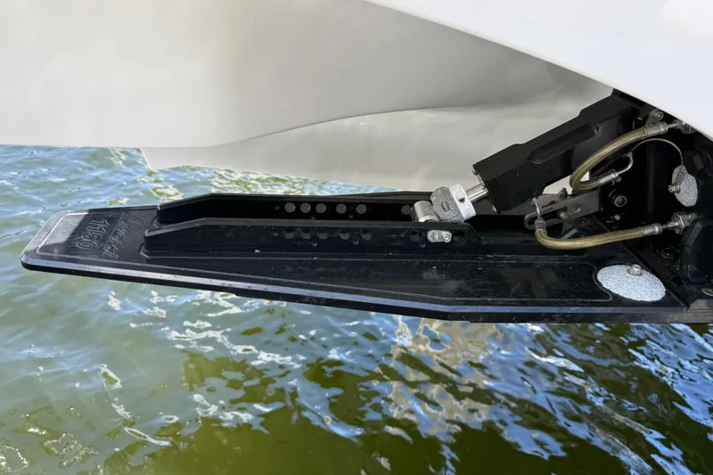 Slide: The Image of Trim tab of 2023 Fountain 38 SCX boat on water. - 26
