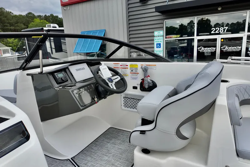 Slide: The Image of 2026 Bayliner VR6 Bowrider OB cockpit with steering wheel and control panel. - 10