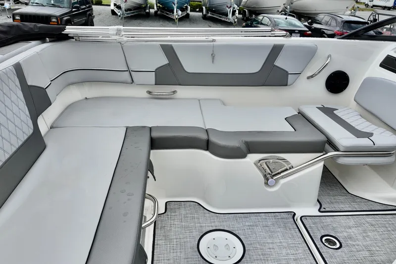 Slide: The Image of 2026 Bayliner VR6 Bowrider OB interior with gray seating and modern design. - 12