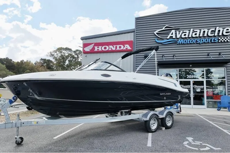 The Image of 2026 Bayliner VR6 Bowrider OB on trailer at Avalanche Motorsports dealership. - 2