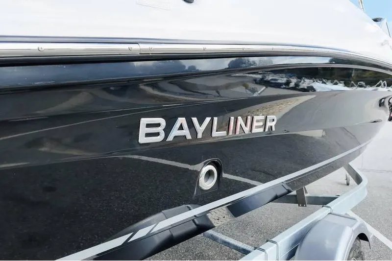 Slide: The Image of 2026 Bayliner VR6 Bowrider OB boat on trailer, close-up view. - 5