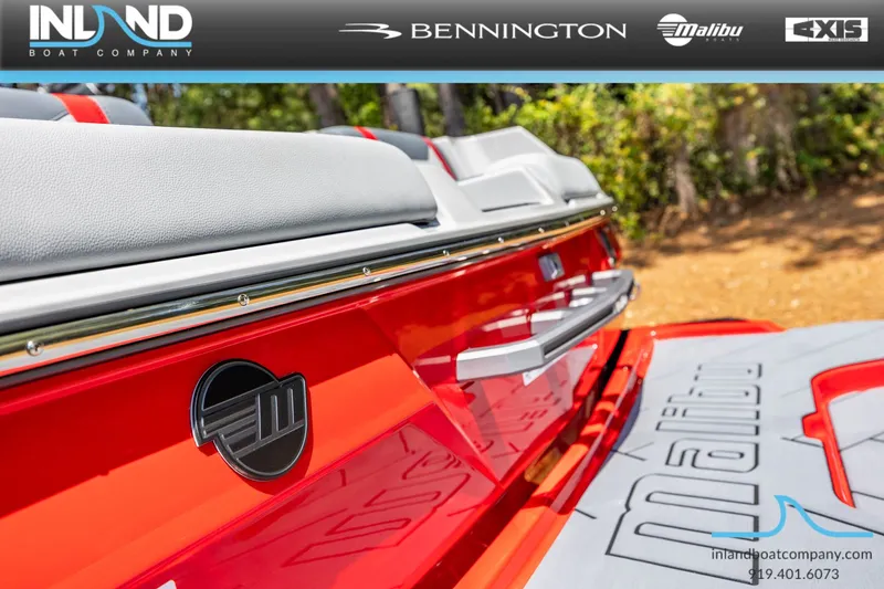 Slide: The Image of Red 2026 Malibu Wakesetter 23 LSV boat, close-up of the rear. - 14