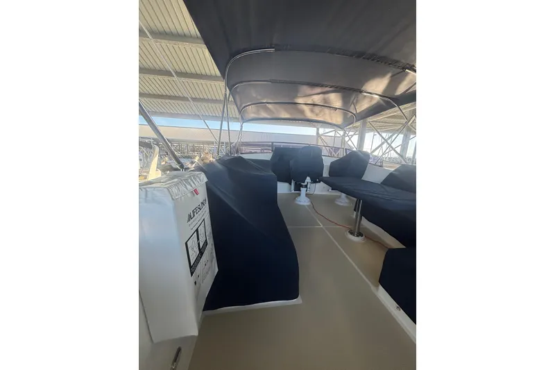 Slide: The Image of 2006 Grand Banks 47 Heritage EU yacht interior with covered seating and canopy. - 12