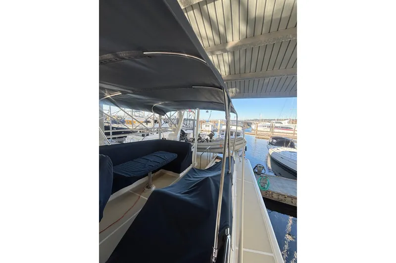 Slide: The Image of 2006 Grand Banks 47 Heritage EU yacht docked under a covered marina. - 13