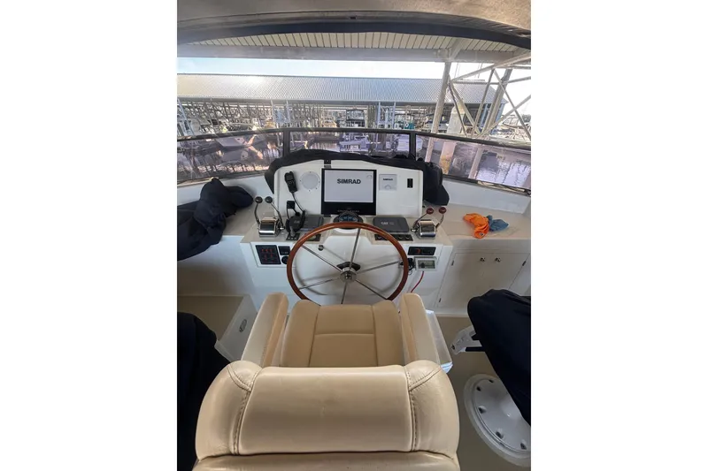 Slide: The Image of Helm of 2006 Grand Banks 47 Heritage EU yacht with steering wheel and navigation equipment. - 15