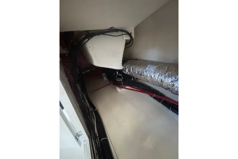 Slide: The Image of Engine room of 2006 Grand Banks 47 Heritage EU with visible wiring and ductwork. - 17