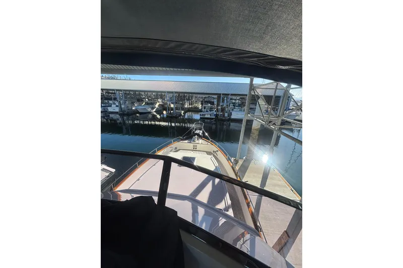 Slide: The Image of 2006 Grand Banks 47 Heritage EU yacht docked at marina, viewed from the helm. - 18