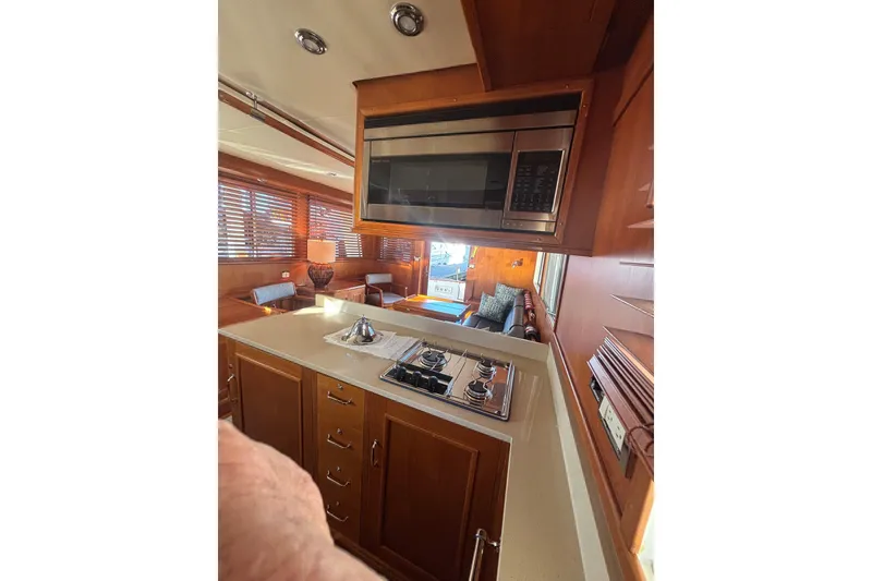 Slide: The Image of Interior of 2006 Grand Banks 47 Heritage EU yacht, featuring a modern kitchen area. - 26