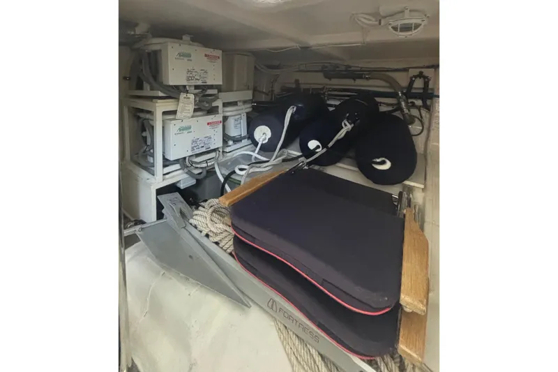 Slide: The Image of Storage area in a 2006 Grand Banks 47 Heritage EU yacht with equipment and cushions. - 44