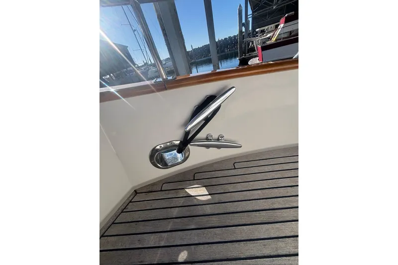 Slide: The Image of Teak deck and cleat on 2006 Grand Banks 47 Heritage EU yacht. - 8
