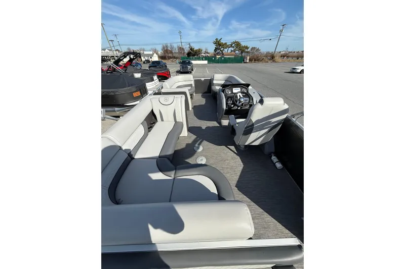 Slide: The Image of 2021 Godfrey Monaco 215 C pontoon boat interior with seating and steering console. - 11
