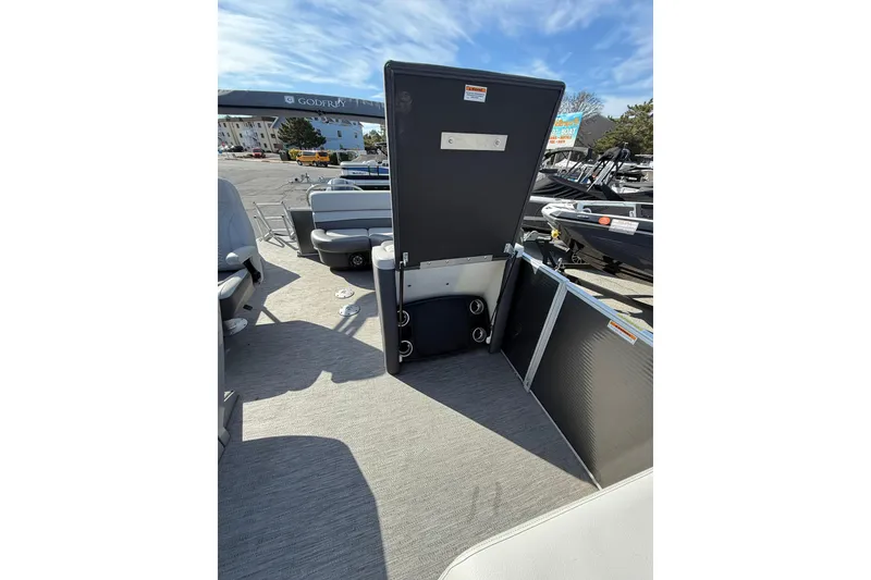 Slide: The Image of 2021 Godfrey Monaco 215 C pontoon boat interior with open storage compartment. - 12