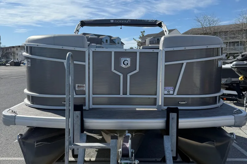 Slide: The Image of 2021 Godfrey Monaco 215 C pontoon boat on trailer in parking lot. - 3