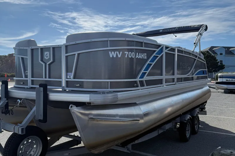 Slide: The Image of 2021 Godfrey Monaco 215 C pontoon boat on trailer in parking lot. - 4