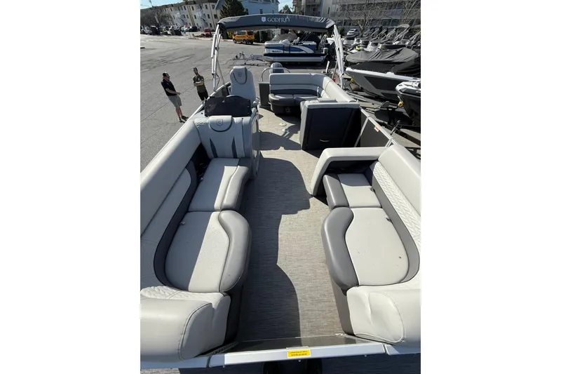 Slide: The Image of 2021 Godfrey Monaco 215 C pontoon boat with spacious seating and modern design. - 9