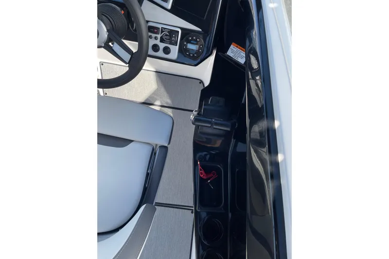 Slide: The Image of 2023 Yamaha Boats AR220 cockpit with steering wheel and control panel. - 5