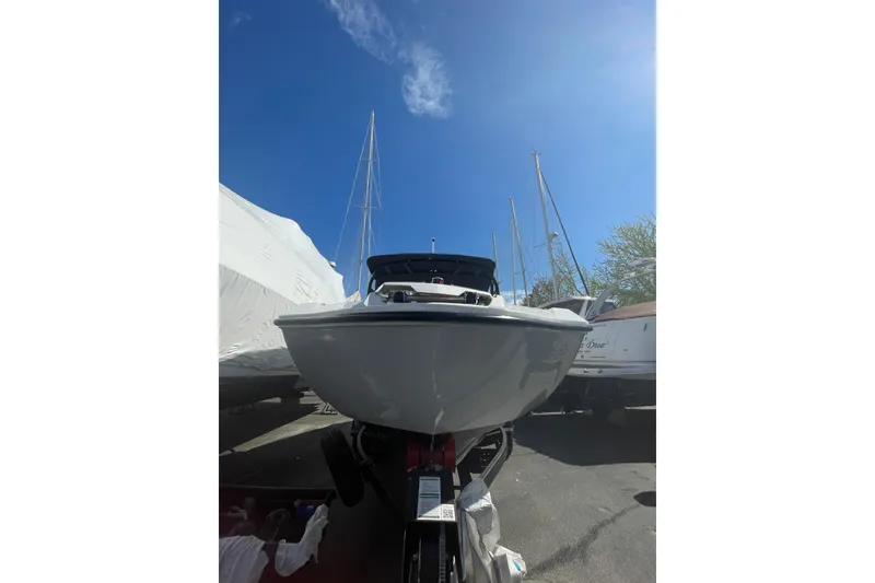 Slide: The Image of 2023 Yamaha Boats AR220 on trailer under clear blue sky. - 8