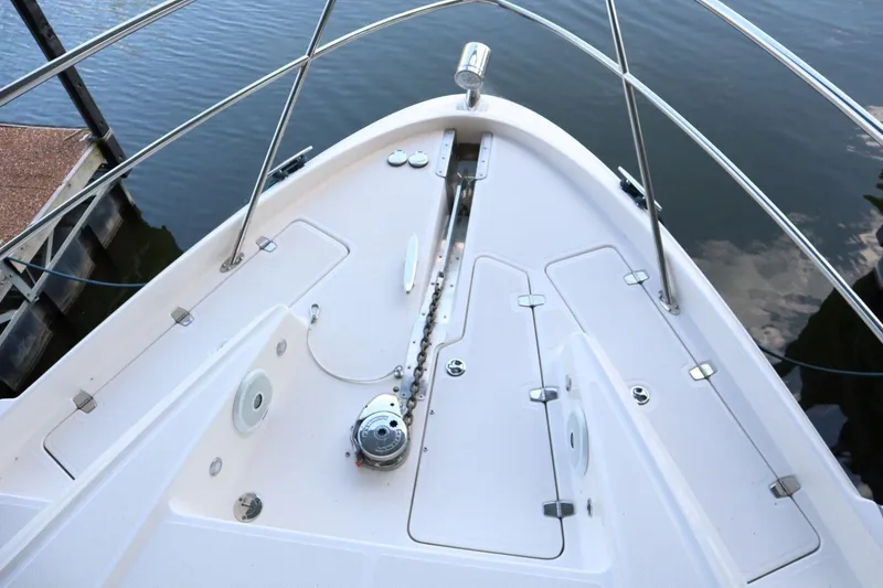 Slide: The Image of Bow of 2010 Regal 46 Sport Coupe yacht with anchor chain and railing. - 10