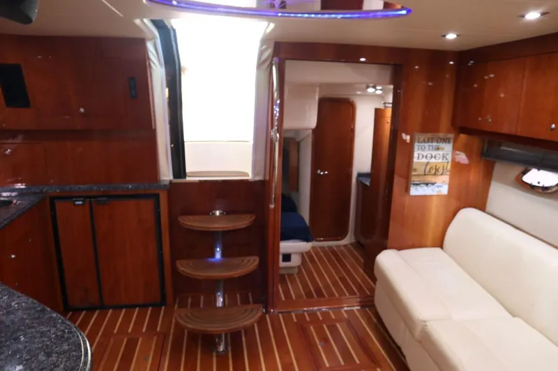 Slide: The Image of Interior of 2010 Regal 46 Sport Coupe with wooden flooring and modern furnishings. - 19