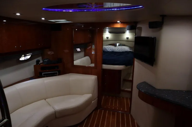 Slide: The Image of Luxurious interior of 2010 Regal 46 Sport Coupe yacht with cozy seating and modern amenities. - 20