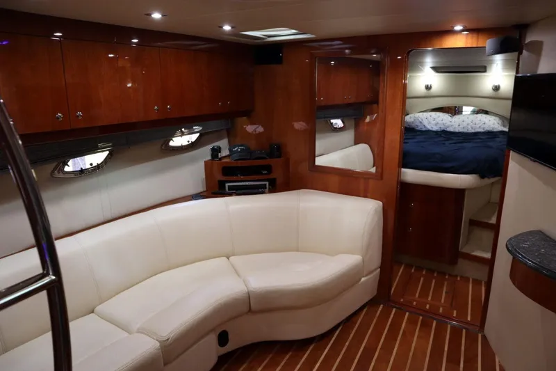 Slide: The Image of Luxurious interior of 2010 Regal 46 Sport Coupe yacht with elegant seating and wood finishes. - 21