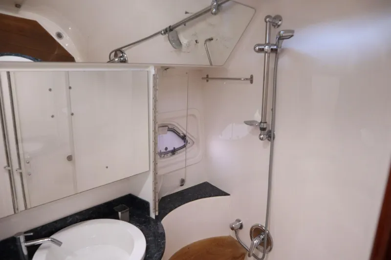 Slide: The Image of Luxurious bathroom in 2010 Regal 46 Sport Coupe yacht with modern fixtures. - 27