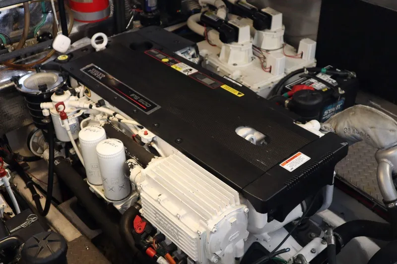 Slide: The Image of Engine room of a 2010 Regal 46 Sport Coupe with detailed components. - 33