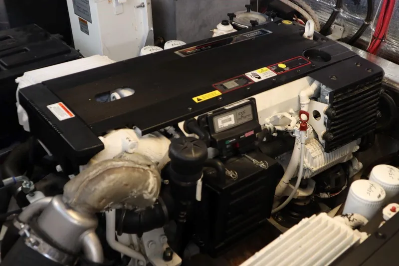 Slide: The Image of Engine compartment of a 2010 Regal 46 Sport Coupe boat, showcasing detailed components. - 34