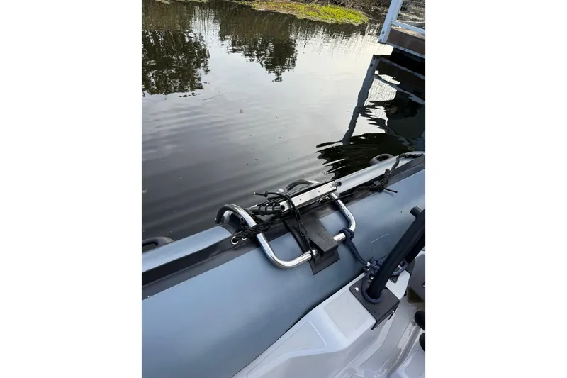 Slide: The Image of 2023 Inmar 660R-PT-PR inflatable boat on calm water near a dock. - 3