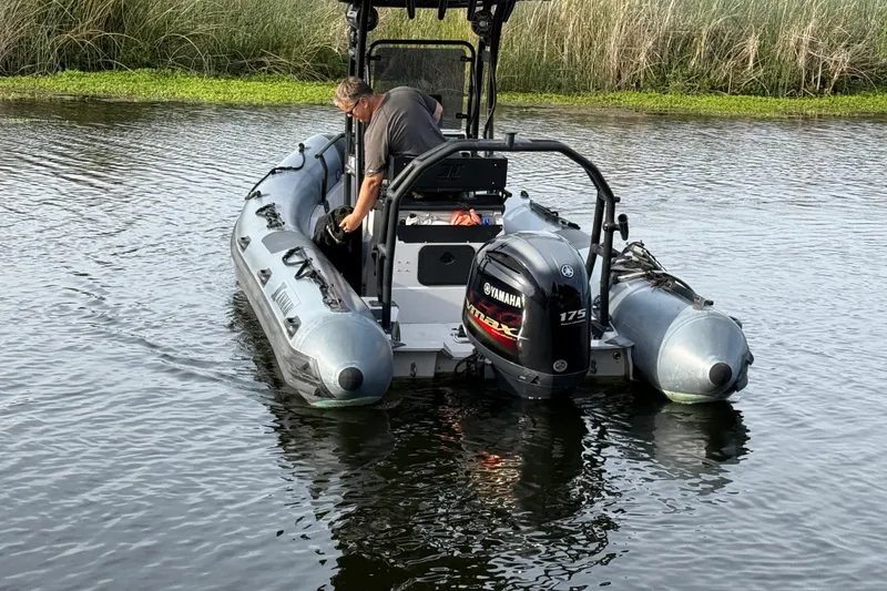 Slide: The Image of 2023 Inmar 660R-PT-PR boat with Yamaha 175 engine on calm water. - 9