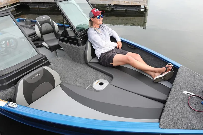 Slide: The Image of Manufacturer Provided Image: 2024 Lund 1775 Adventure Sport boat with open storage compartments on the water. - 2