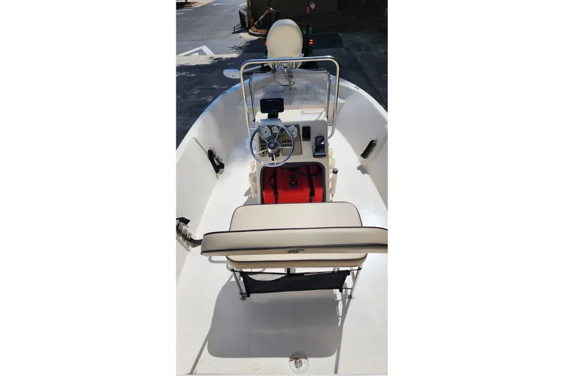 Slide: The Image of 2024 Carolina Skiff EV180 Sea Skiff interior with steering console and seating. - 5