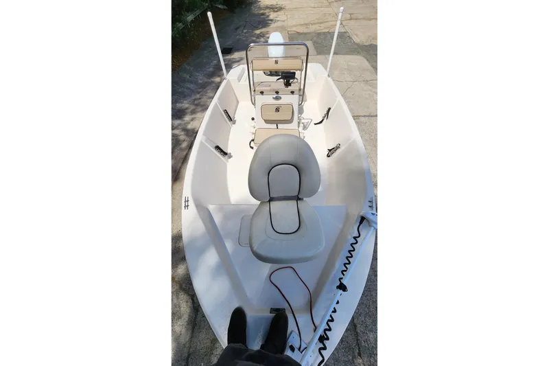 Slide: The Image of 2024 Carolina Skiff EV180 Sea Skiff interior with seating and console, viewed from above. - 6