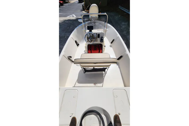 Slide: The Image of 2024 Carolina Skiff EV180 Sea Skiff interior with steering console and seating. - 8