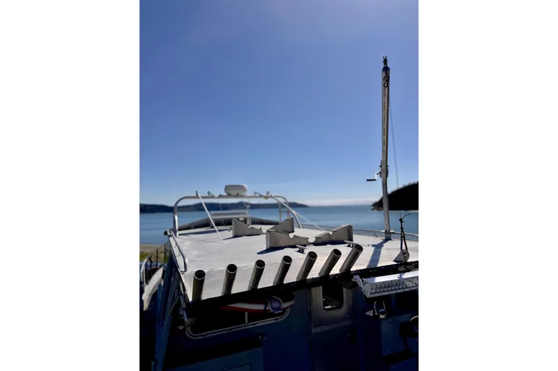 Slide: The Image of Maxweld Maxcat 2001 boat on water with clear blue sky background. - 10