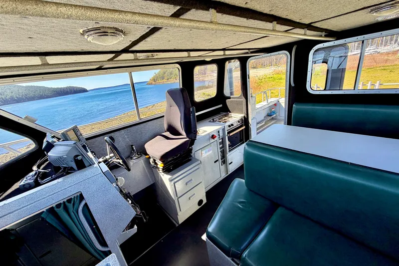 Slide: The Image of Interior of 2001 Maxweld Maxcat boat with scenic ocean view through windows. - 18