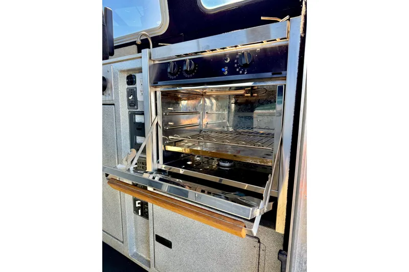 Slide: The Image of Stainless steel oven in a 2001 Maxweld Maxcat boat interior. - 20