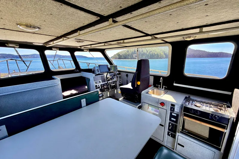 Slide: The Image of Interior of 2001 Maxweld Maxcat boat with scenic ocean view through windows. - 22