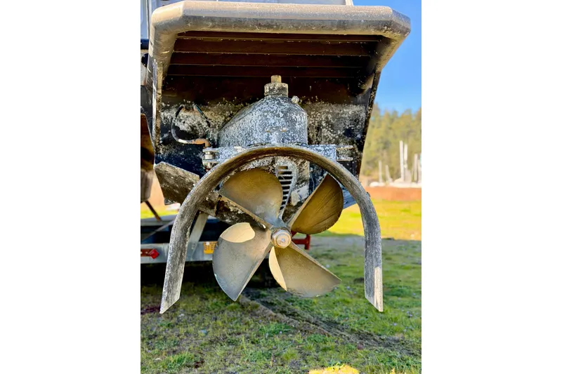 Slide: The Image of Close-up of a 2001 Maxweld Maxcat boat propeller with visible wear. - 5