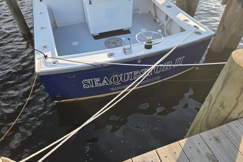 Slide: The Image of 1977 JC 31 Casco Bay boat named Seaquestor II docked at marina. - 24