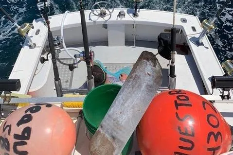 Slide: The Image of Fishing boat deck with gear, buoys, and rods on a 1977 JC 31 Casco Bay. - 6