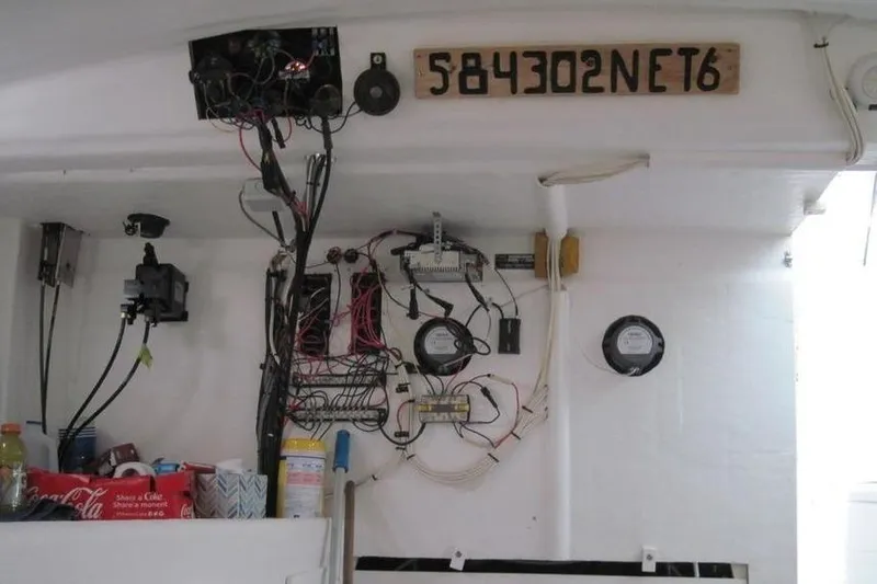 Slide: The Image of Electrical panel and wiring inside a 1977 JC 31 Casco Bay boat. - 8