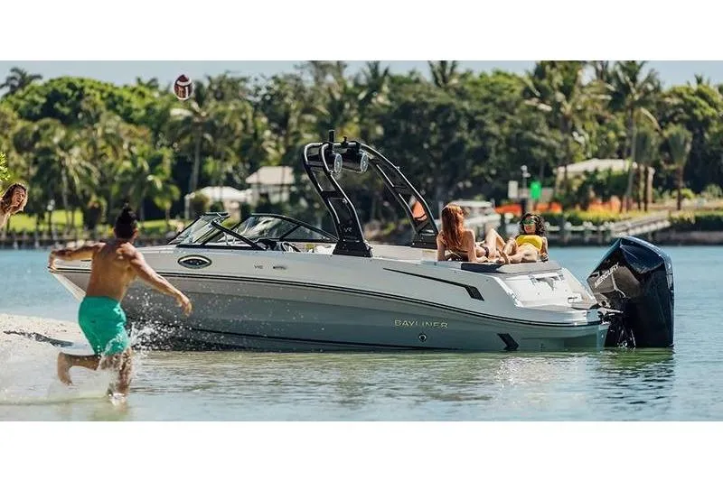 The Image of 2026 Bayliner VR6 Bowrider OB on water, people enjoying sunny day. - 1