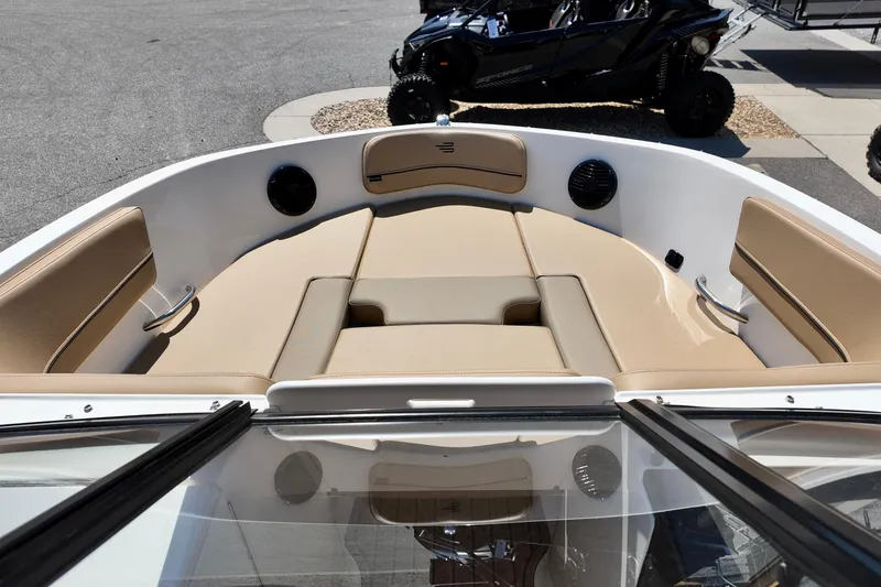 Slide: The Image of 2026 Bayliner VR6 Bowrider OB interior with beige seating and modern design. - 2