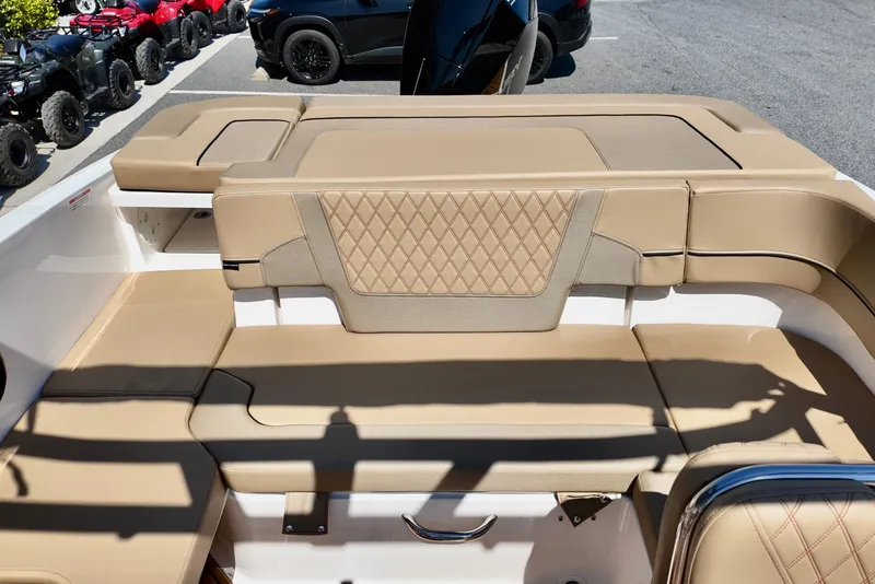 Slide: The Image of Luxurious seating on 2026 Bayliner VR6 Bowrider OB, featuring tan upholstery and diamond stitching. - 8