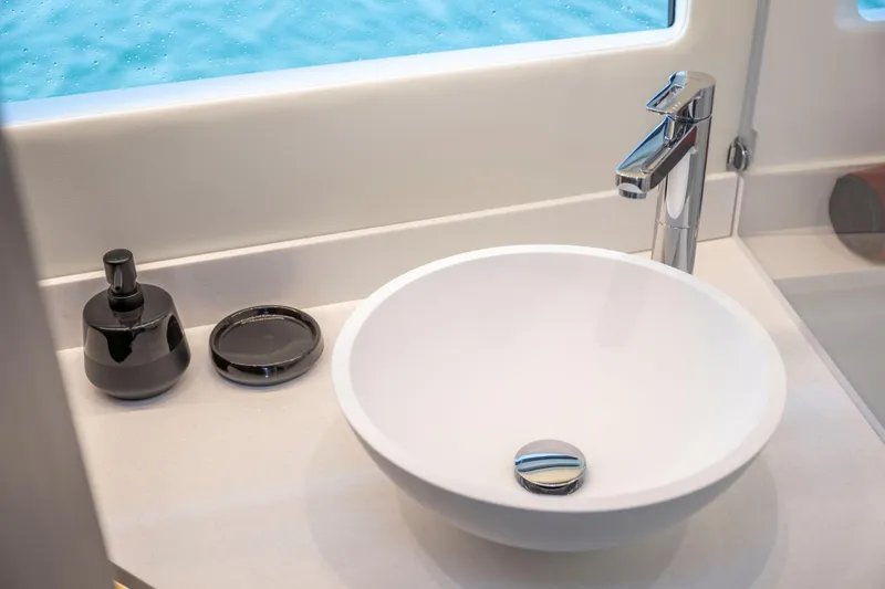 Slide: The Image of Modern bathroom sink on Jeanneau NC 1295 Coupe 2026 yacht, with sleek faucet and accessories. - 13
