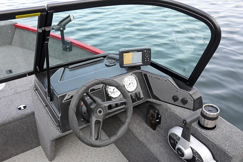 Slide: The Image of Manufacturer Provided Image: 2025 Lund 1650 Angler Sport boat on a lake with two people fishing. - 2