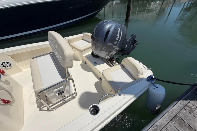 Slide: The Image of 2026 Scout 188 Sportfish boat with Yamaha engine docked at marina. - 4