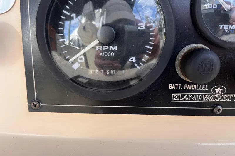 Slide: The Image of Close-up of Island Packet 350 boat RPM gauge, showing 2153 hours. - 21